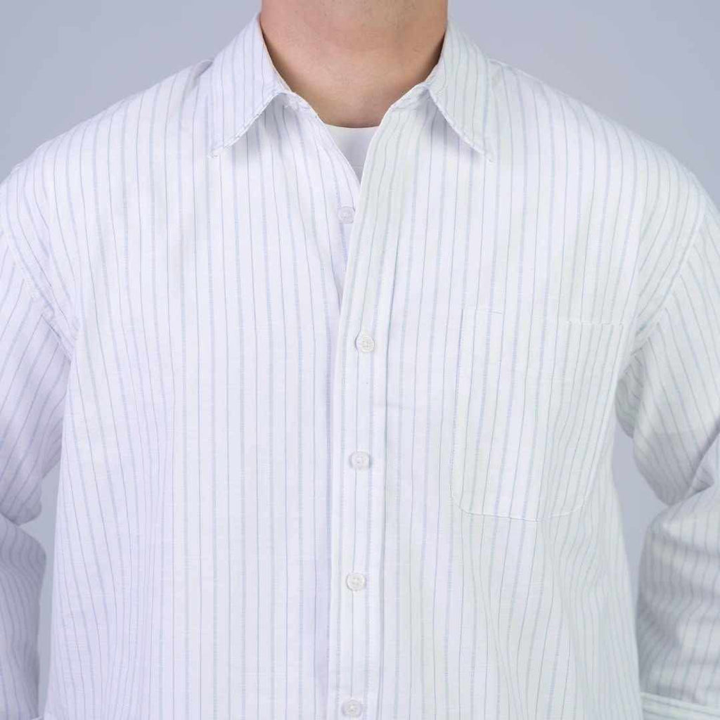 Rare boxy fit striped shirt with long sleeves and a classic collar, featuring blue and white horizontal stripes.