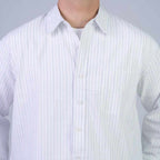 Rare boxy fit striped shirt with long sleeves and a classic collar, featuring blue and white horizontal stripes.