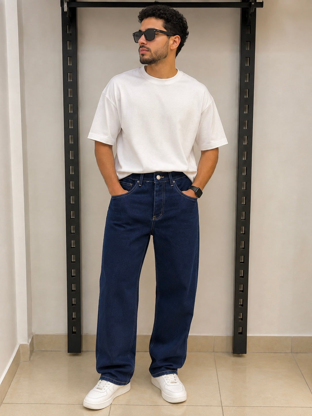 Rare STWD Jeans shown in dark wash with classic five-pocket design and slim fit cut on a model.