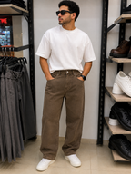 Rare brown washed jeans, casual denim with distressed details and classic five-pocket design, displayed on a plain background.
