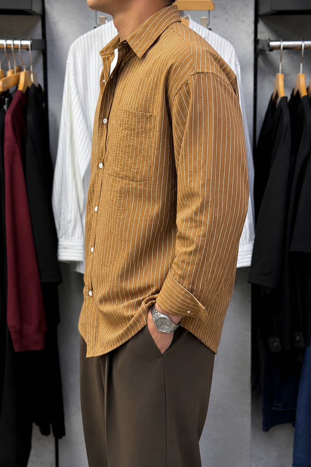 Rare boxy fit striped shirt with long sleeves and classic collar, featuring bold horizontal stripes on lightweight fabric.