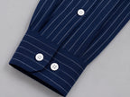 Rare boxy fit striped shirt with a classic collar and long sleeves, featuring bold horizontal stripes in black and white.