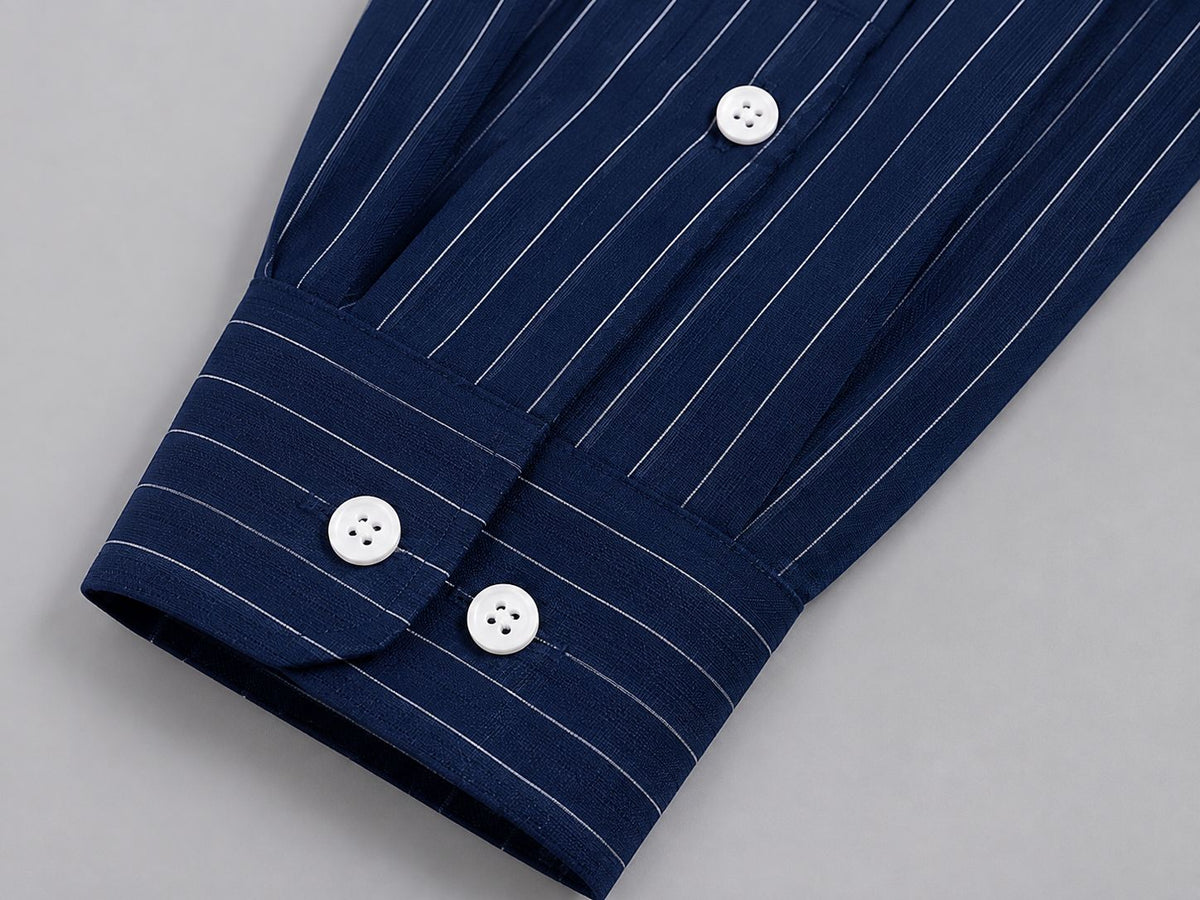 Rare boxy fit striped shirt with a classic collar and long sleeves, featuring bold horizontal stripes in black and white.