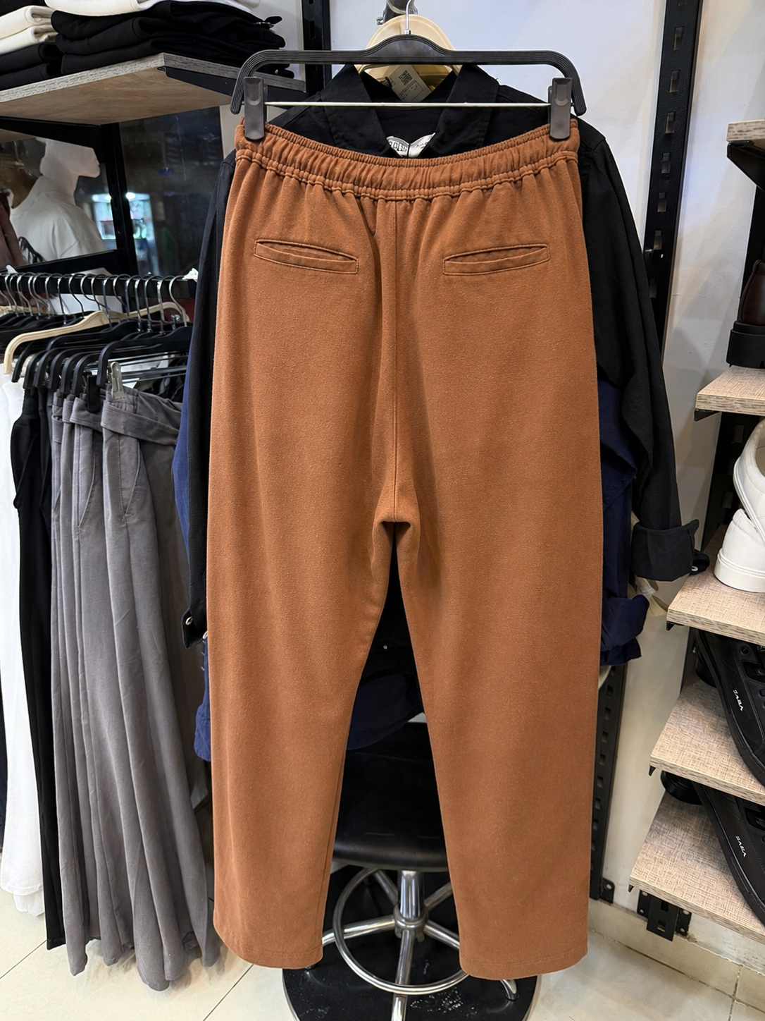 Rare linen pant with a relaxed fit and neutral color, featuring a comfortable waistband and tapered leg design.