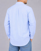 Rare boxy fit striped shirt with long sleeves, featuring a classic crew neckline and bold horizontal stripe pattern.