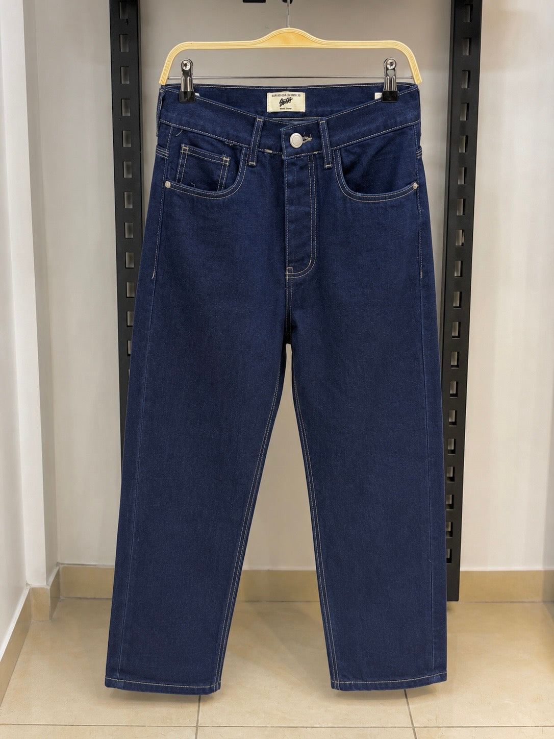 Rare STWD jeans showing slim fit design with classic denim fabric and five-pocket styling.