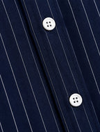 Rare boxy fit striped shirt with long sleeves and classic collar, displayed on a plain background.