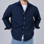Rare boxy fit striped shirt with long sleeves and classic collar, featuring bold horizontal stripes in neutral colors.