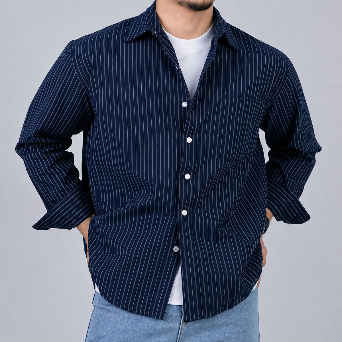 Rare boxy fit striped shirt with long sleeves and classic collar, featuring bold horizontal stripes in neutral colors.
