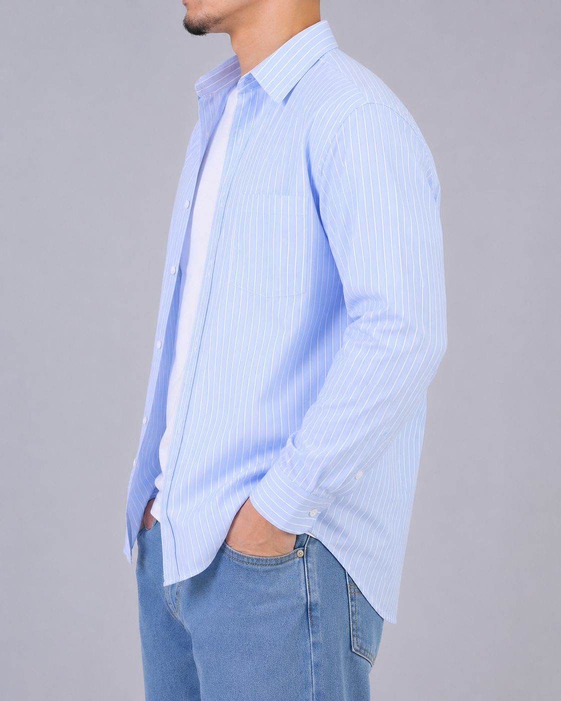Rare boxy fit striped shirt with long sleeves and collar, featuring a classic pattern on lightweight fabric.
