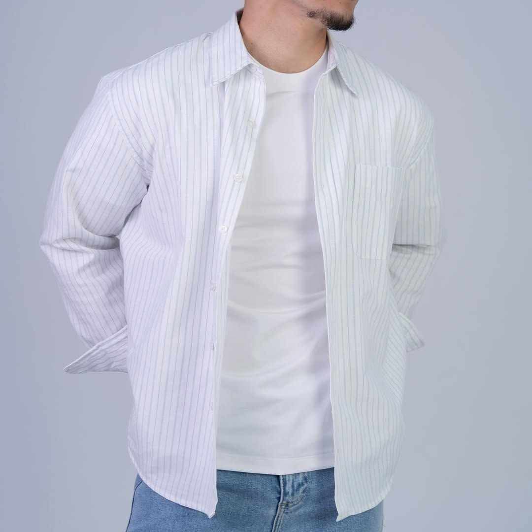 Rare boxy fit striped shirt with long sleeves and classic collar, featuring bold horizontal stripes and a relaxed, casual style.