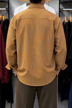 Rare boxy fit striped shirt with long sleeves and a classic collar, featuring a bold striped pattern.