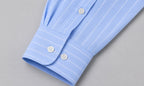 Rare boxy fit striped shirt with long sleeves and classic collar, displayed flat on a neutral background.