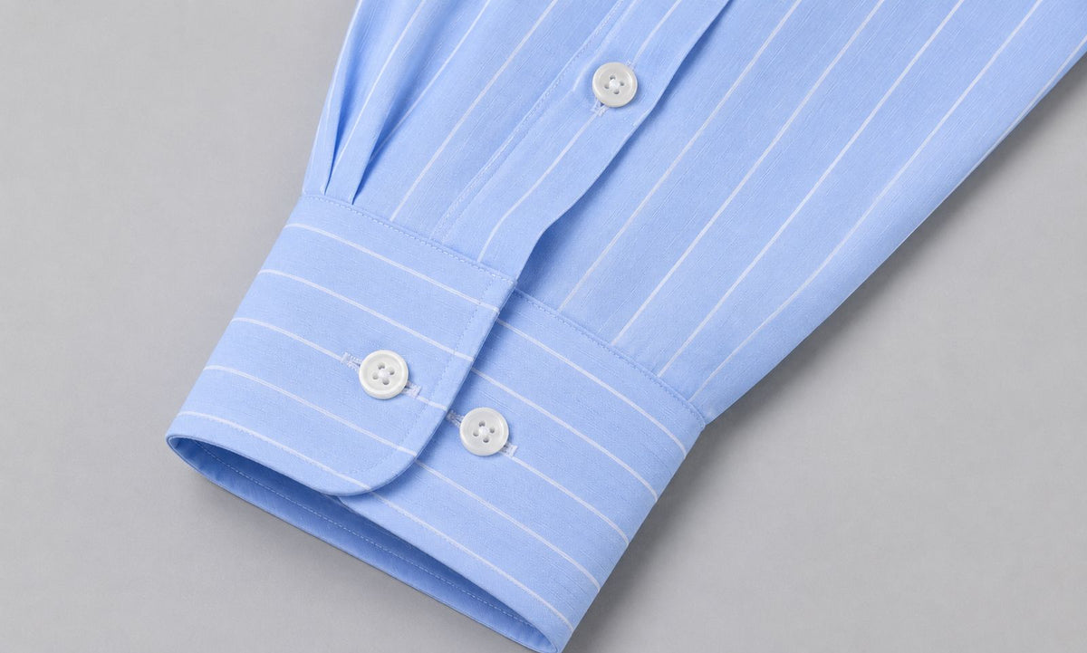 Rare boxy fit striped shirt with long sleeves and classic collar, displayed flat on a neutral background.