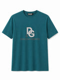 Rare D&G Monogram Graphic Crewneck T-Shirt in teal with bold logo print, casual fit, and soft cotton fabric.