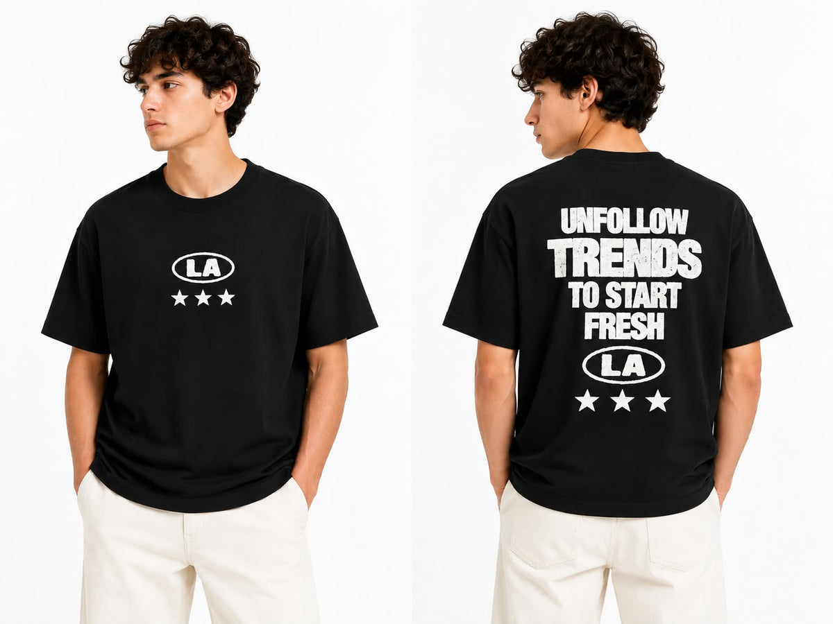 Black oversized graphic T-shirt by rare, featuring bold print design on the front, casual streetwear style for men or women.
