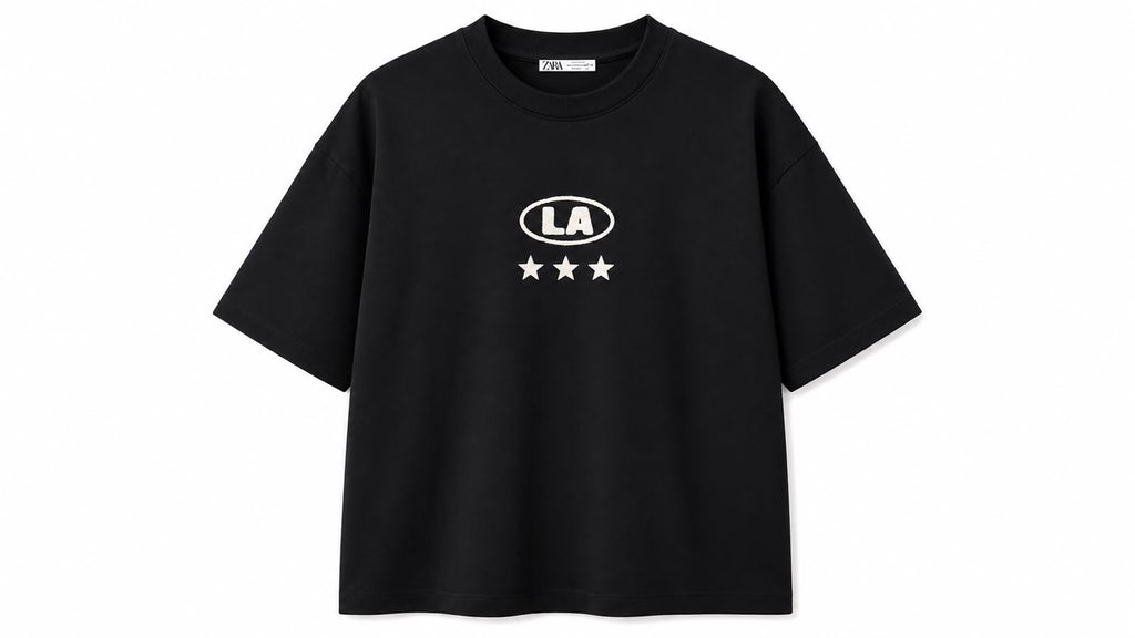 Black oversized graphic tee by rare with bold design on front, relaxed fit, casual style, laid flat for display.