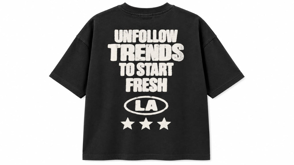 Black graphic oversized tee by rare, featuring bold design and relaxed fit, displayed flat on a plain background.