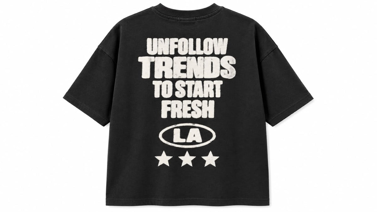 Black graphic oversized tee by rare, featuring bold design and relaxed fit, displayed flat on a plain background.