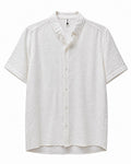 Rare short-sleeve textured button shirt displayed on a hanger, featuring a subtle pattern and classic collar detail.