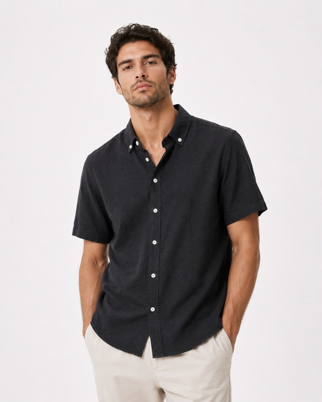 Rare short-sleeve textured button shirt displayed on a hanger, showcasing its fabric details and casual fit.