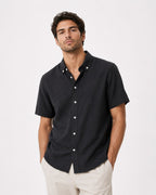Rare short-sleeve textured button shirt displayed on a hanger, showcasing its fabric details and casual fit.
