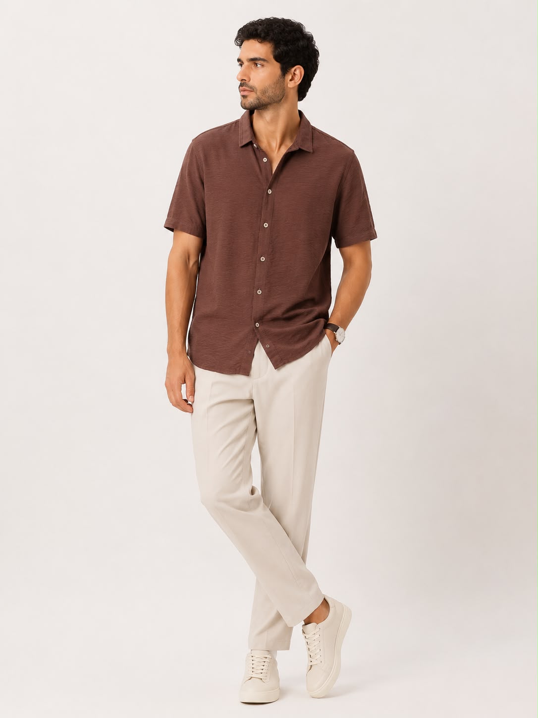 Rare short-sleeve textured button-up shirt in a casual fit, displayed on a hanger with visible fabric details.