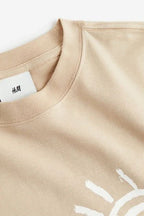 Light beige minimal sun line art T-shirt by rare, featuring a simple sun design on soft cotton fabric.