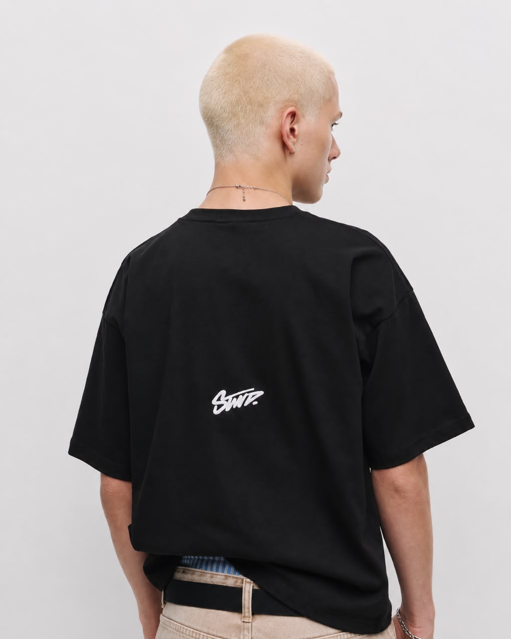 Black oversized "Sartre" embroidered T-shirt by rare, featuring bold embroidered text on soft cotton fabric.