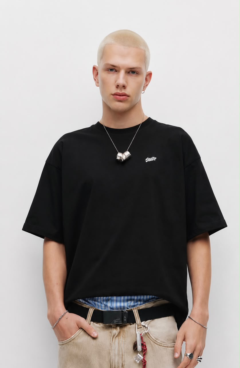 Black "Sartre" embroidered oversized T-shirt by rare featuring front embroidery and relaxed fit, casual streetwear style.