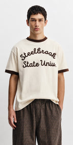 Rare Off-White Steelbrook State University ringer T-shirt with university logo and bold graphic on white fabric.