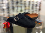 Black Glogges by Rare featuring a sleek black design with textured details and a comfortable fit.