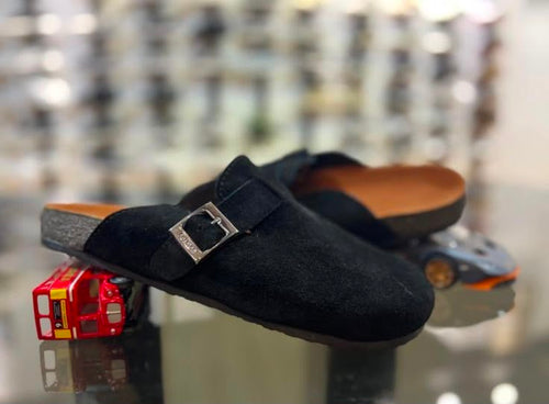 Black Glogges by Rare featuring a sleek black design with textured details and a comfortable fit.