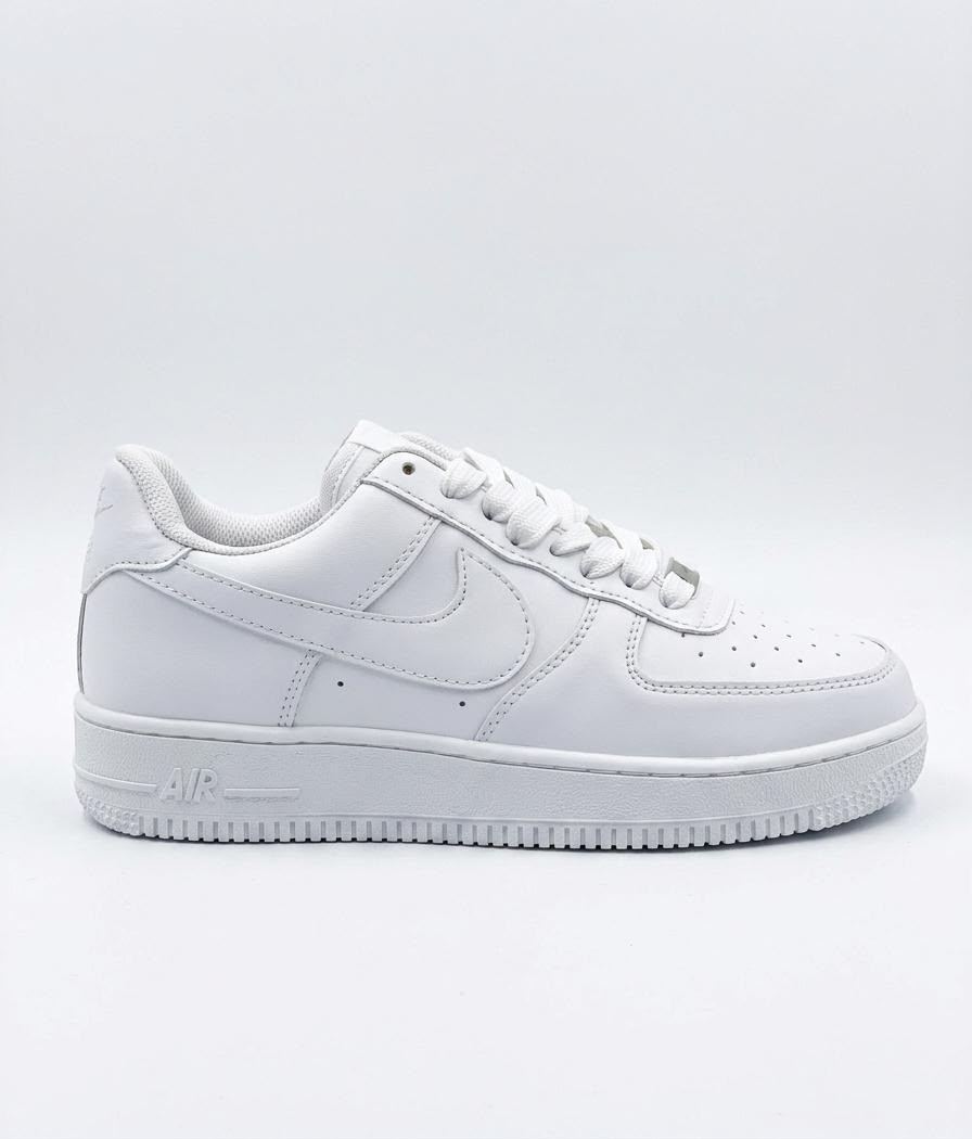 Rare Nike white Air Force sneakers shown in a clear side view, highlighting the classic design and clean white leather upper.