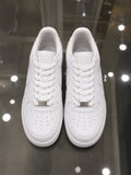 Rare Nike white Air Force sneakers, close-up view showing clean leather upper and classic design.