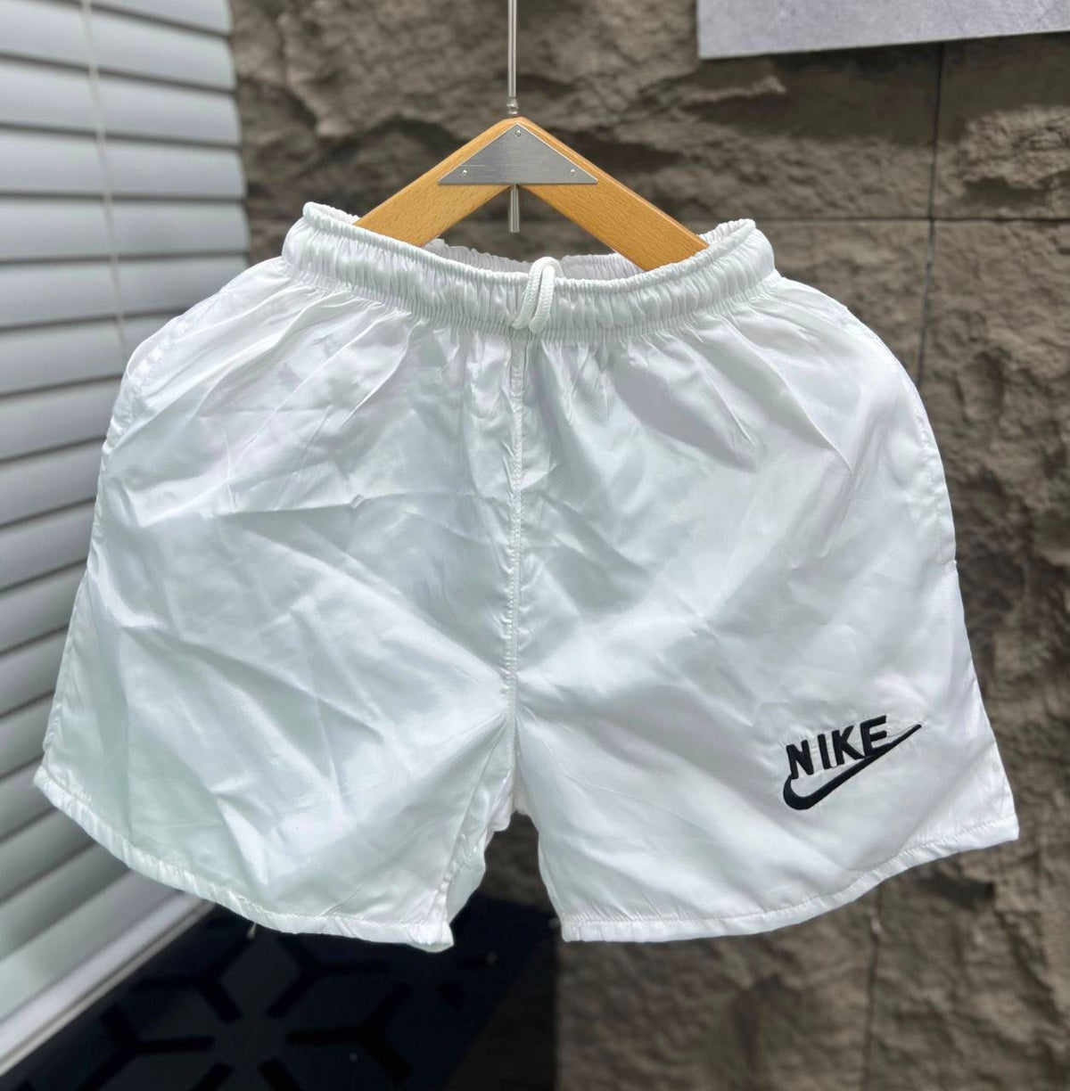 Rare swimsuit shorts shown on a model, featuring a stylish design with a comfortable fit for beach or poolside wear.