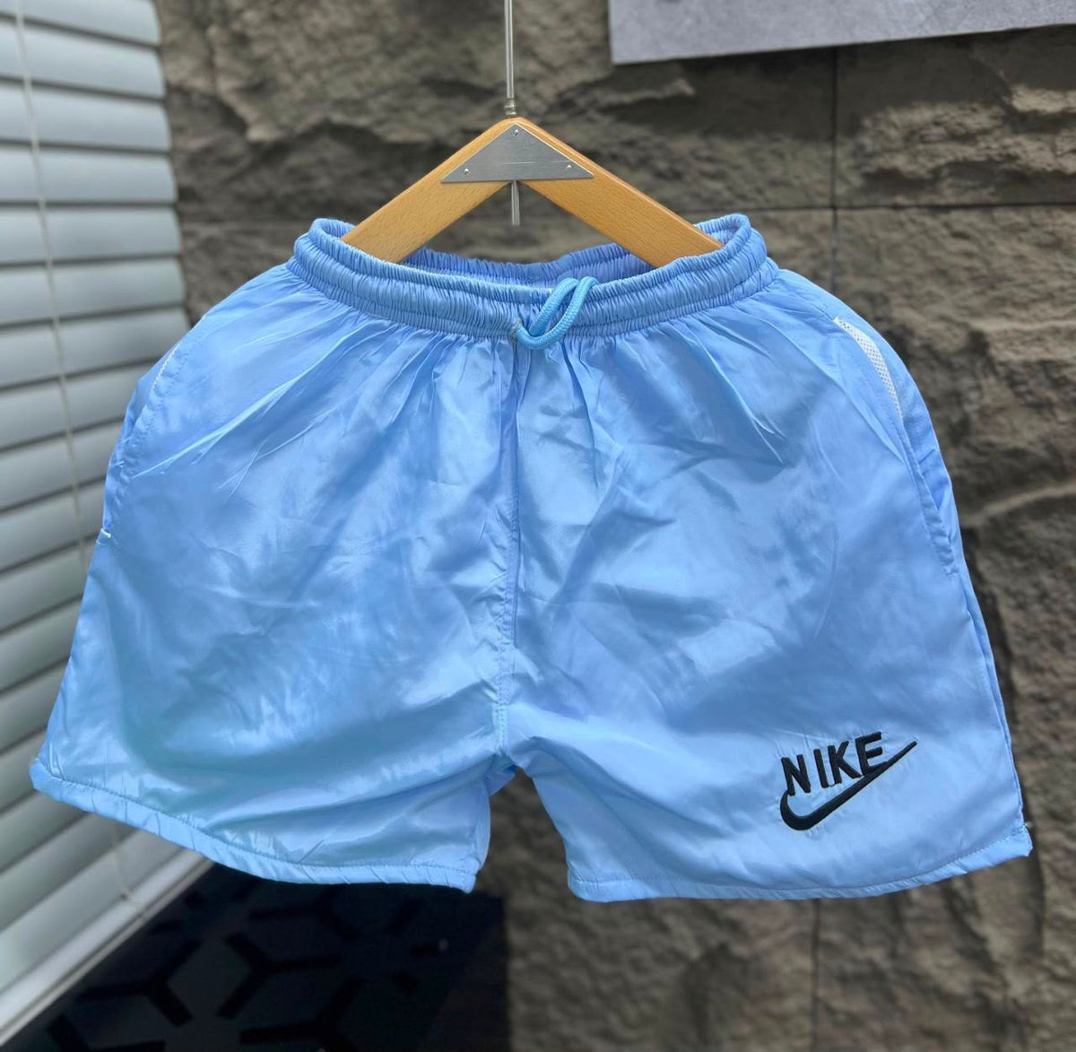 Rare swimsuit shorts displayed on a model, featuring a stylish design and comfortable fit suitable for beach or poolside wear.