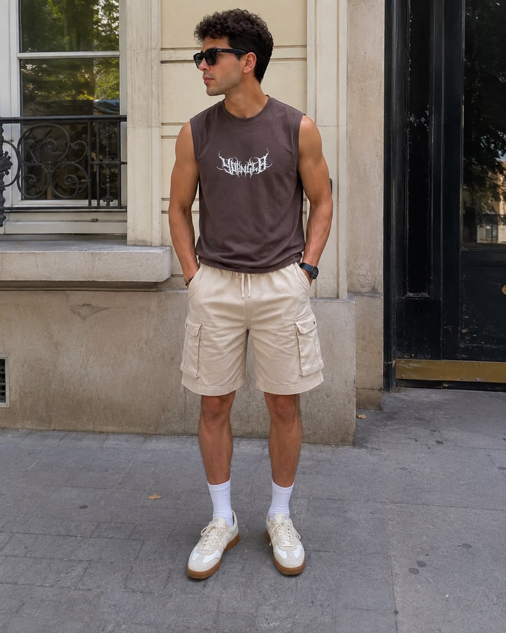 Rare sleeveless muscle tank top, close-up view showing black fabric, round neckline, and sleeveless design on a plain background.