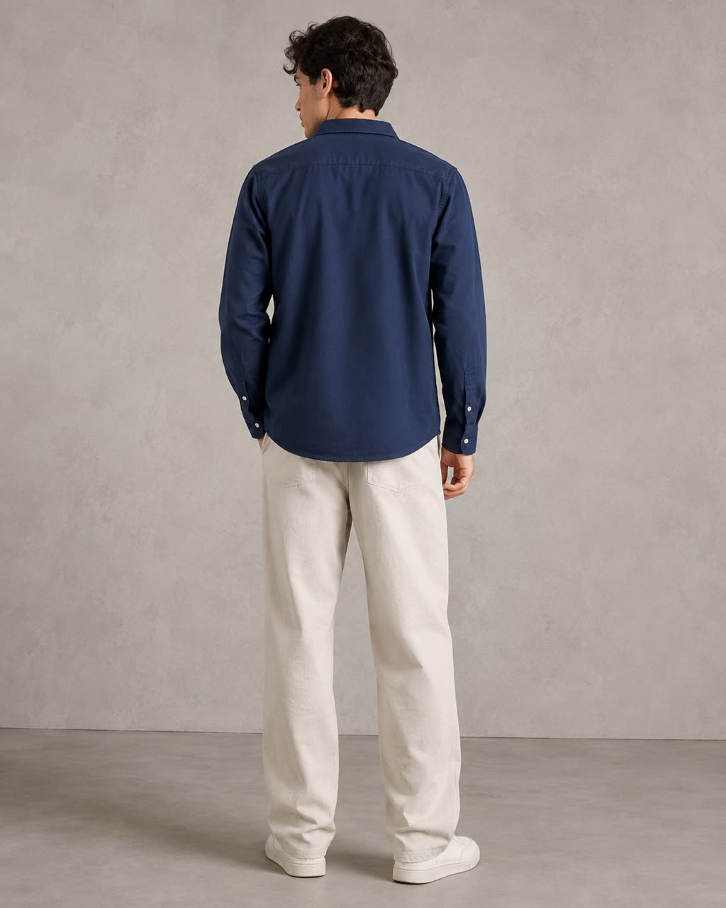 Rare linen shirt displayed on a hanger, showcasing lightweight, breathable fabric with a classic collar and button-down design.