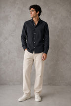 Rare linen shirt displayed on a hanger, showcasing lightweight, breathable fabric with a classic collar and button-down front.