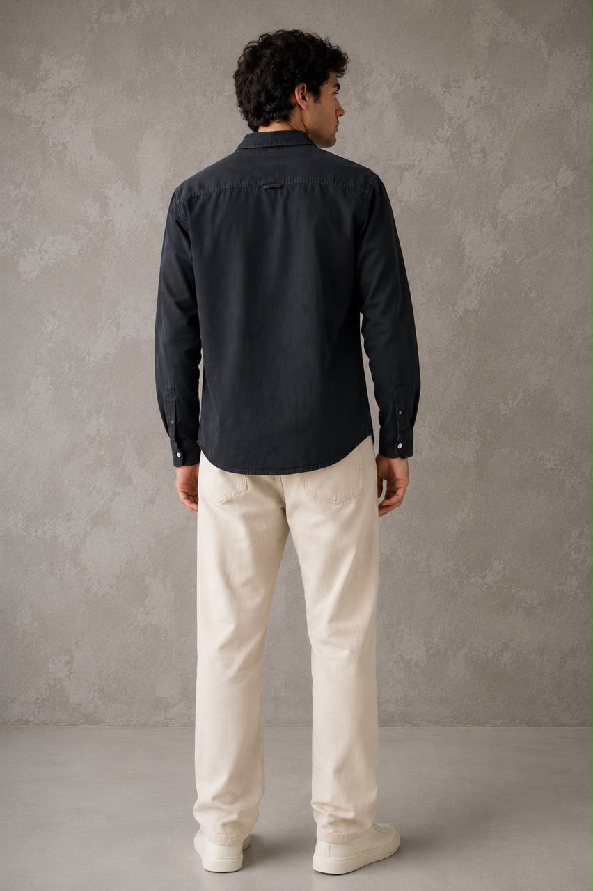 Rare linen shirt displayed on a hanger, showcasing its lightweight, breathable fabric and classic casual style.