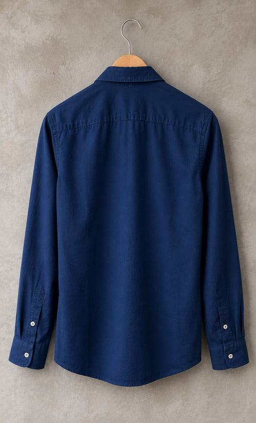 Rare linen shirt displayed on a hanger, showcasing lightweight, breathable fabric and classic design.