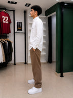 Rare American Eagle shirt displayed on a hanger with a casual fit, featuring a classic design and soft fabric.