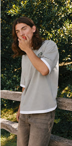 Rare Ringer P&B T-shirt featuring a classic black and white design with contrasting collar and sleeves on a model.