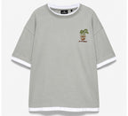 Rare ringer P&B tee featuring a classic white and black design, with a comfortable fit and bold branding on the front.